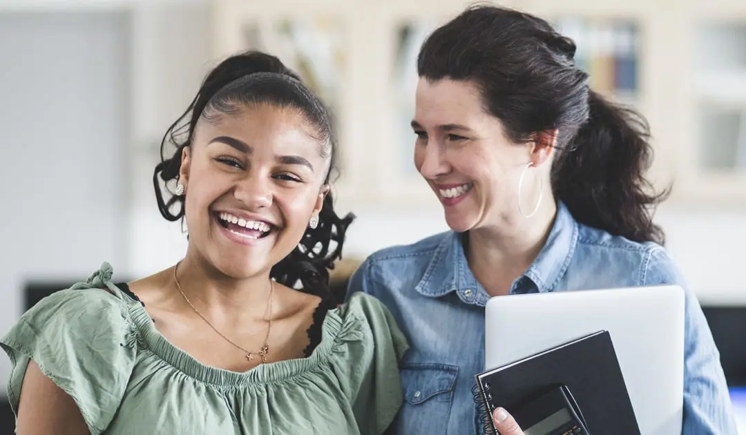 Two women smiling