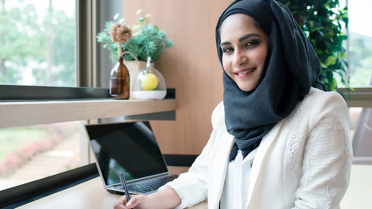 Education professional sitting at desk.