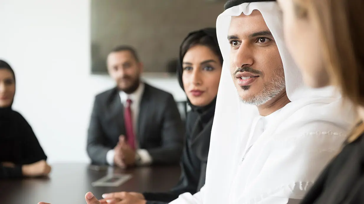 A man speaking during a business meeting. 