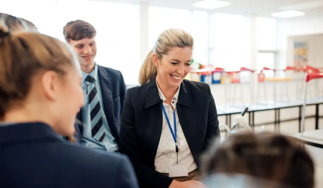 Teacher and students smiling